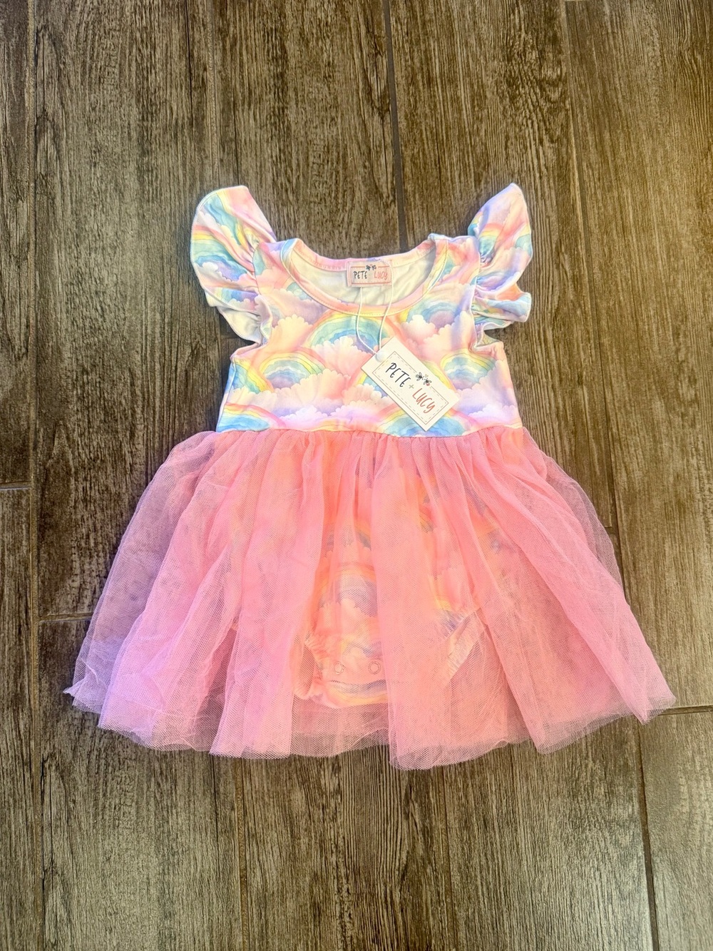 NWT Pete & Lucy rainbow onsie.